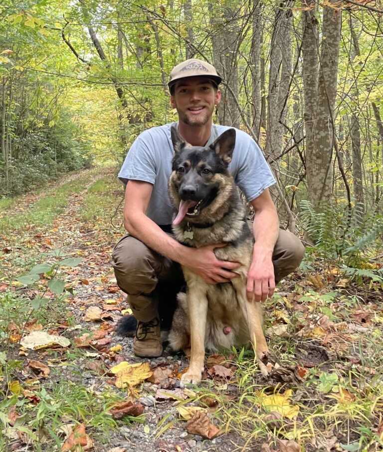Jackson Singleton From Rocksteady with dog in nature