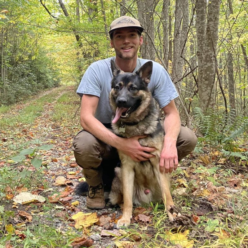 Jackson Singleton From Rocksteady with dog in nature